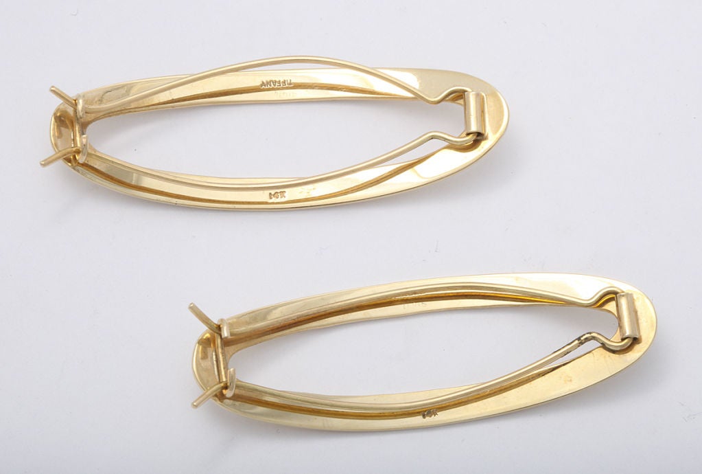 A pair of sizable yet understated Tiffany barrettes in 14K gold. 2 1/2 inches. Tiffany mark.