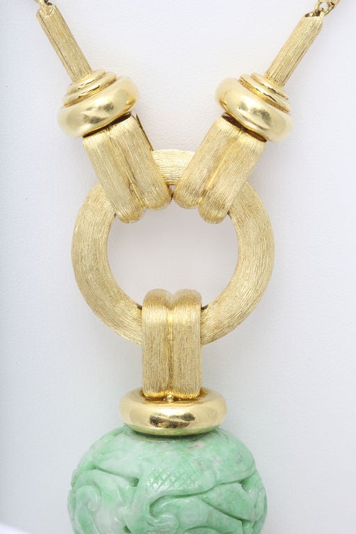Long and elegant Henry Dunay 18K gold necklace of hand textured cylindrical links holding a large ring and tassel, incorporating a large antique jade ball originally used as a hat ornament for an official the Chinese royal court (c.1900). The