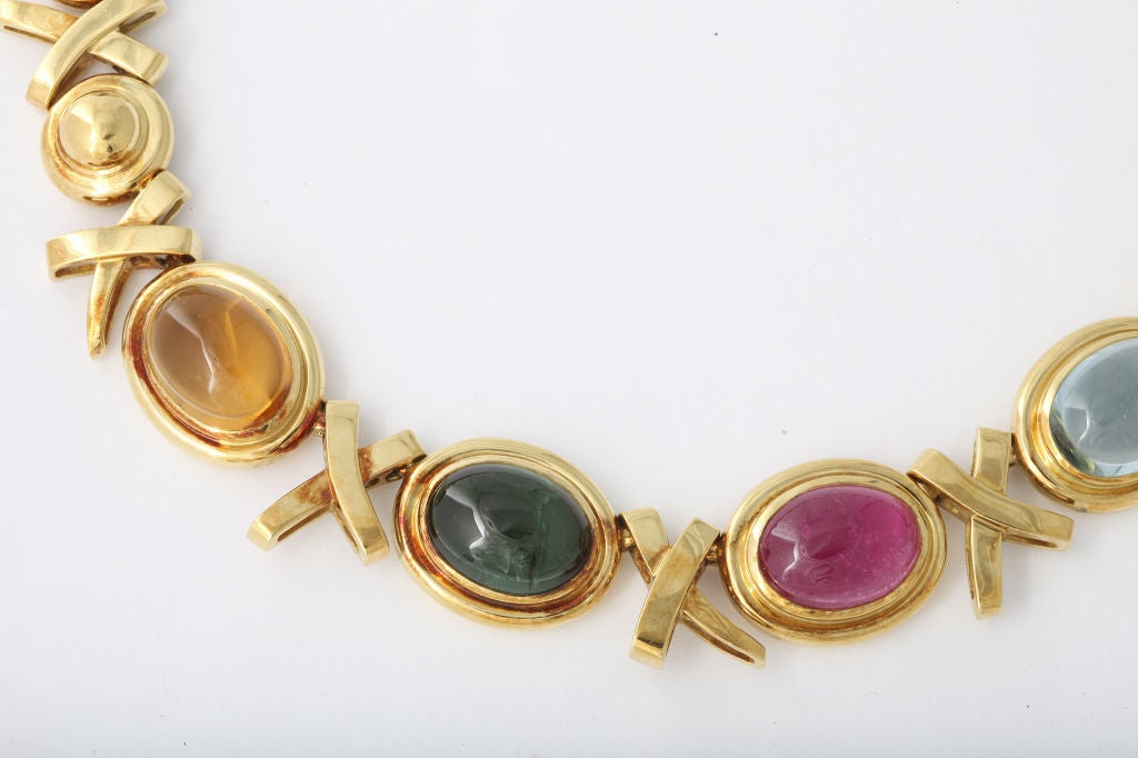 Beautiful Tiffany necklace disign by Paloma Picasso from the Love and Kisses collection in 18K gold set with colorful large cabochon cut stones of citrine,  tourmaline, and amethyst. 16