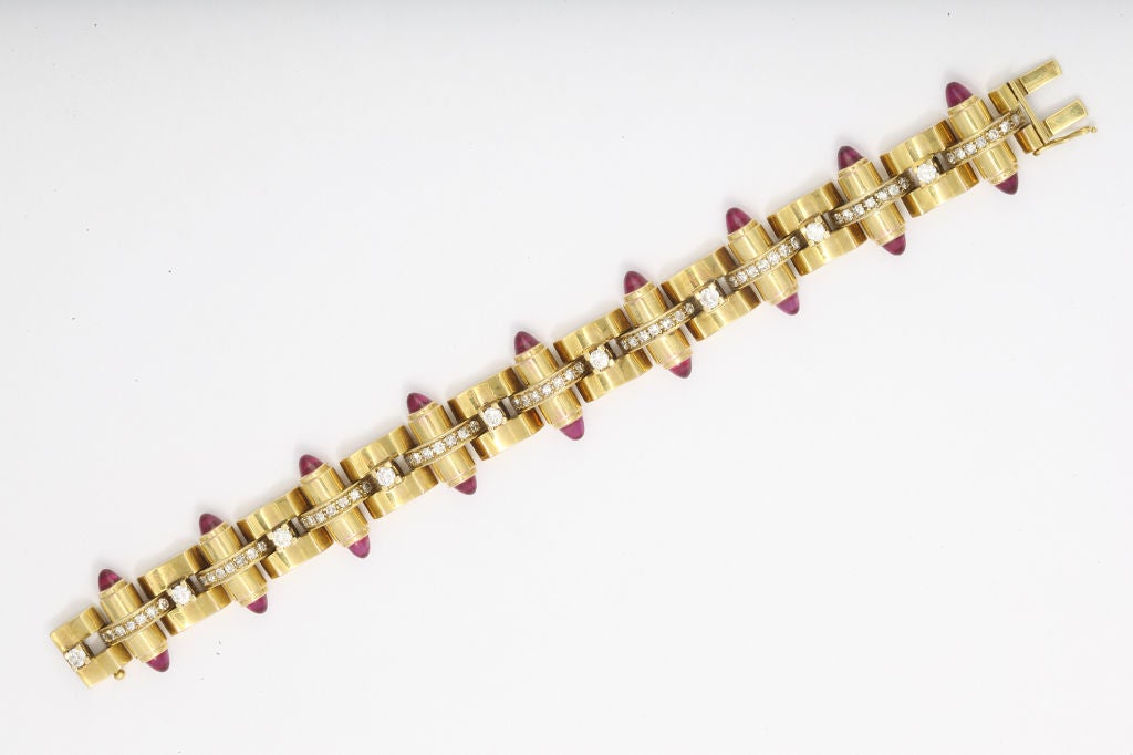 Walser Wald retro bracelet of 18K gold set with diamonds and synthetic ruby cabochons. 7 inches. Gold mark, Makers mark and Buenos Aires. In original box printed with maker/retailer name and address.