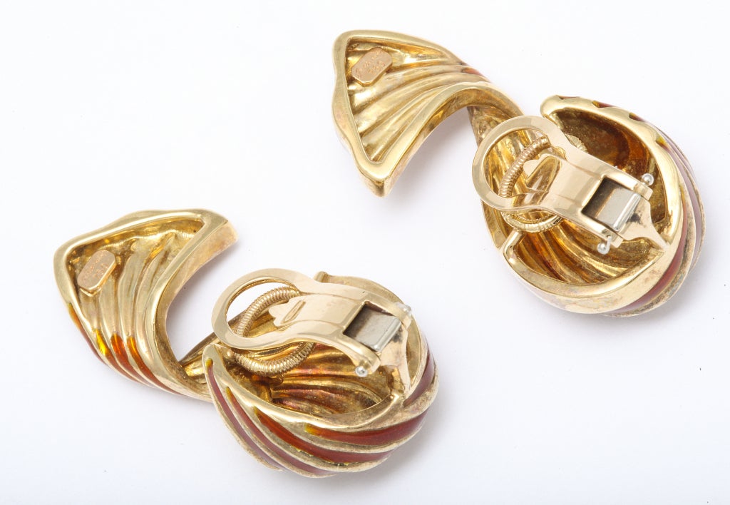 Fanciful Judith Leiber ear clips, looking like wrapped candy, in enameled 18kt gold. Lieber mark. 1 1/2 inches.