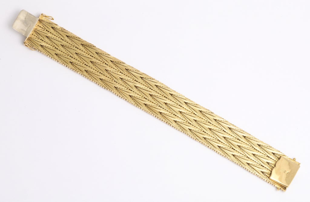 A beautifully precision woven 18K gold bracelet by Cartier, for lady or gentleman.  61.2 dwt. 7 3/4 in. Marked 750, Cartier France, registry numbers, makers mark.