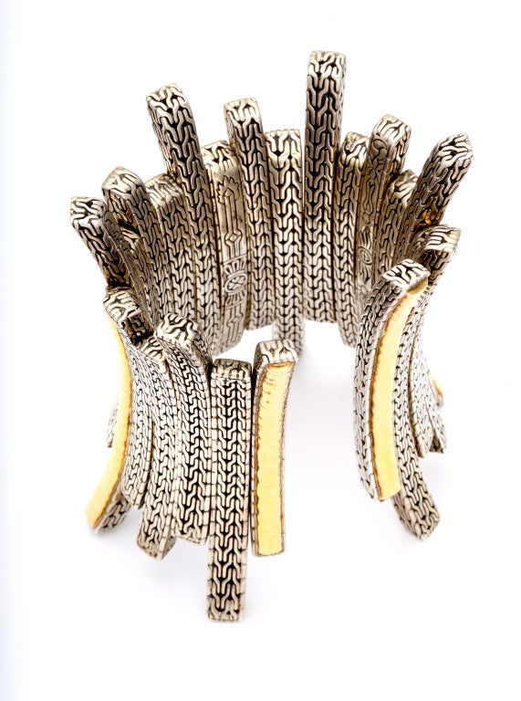Unusually high style John Hardy gold and silver bracelet - most likely a private or couture order - of long, square, curved, hand made openwork links, alternating with silver chain and hammered gold motifs. Springs open from 7 to 7 1/2 inches.