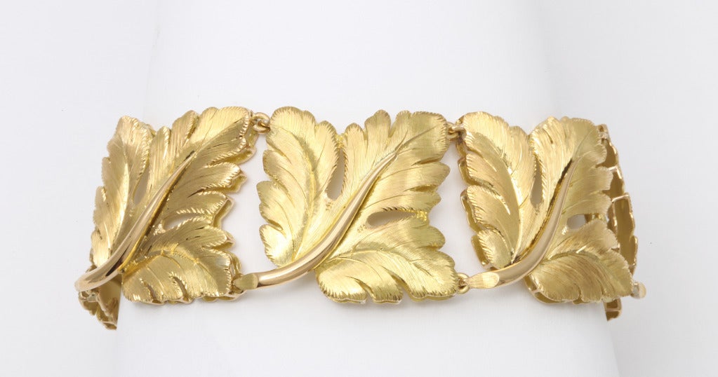 Classicly beautiful bracelet by Tiffany & Co. Italy, as repeated leaves of 18K gold, with polished stems and lightly brushed leaves with an obvious nod to Buccellati, built on a slightly elivated framework for a floating effect. *Worn in what would