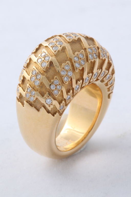 Limited production Christian Dior ring of 18KT gold set with diamonds, pattered overall in high relief with the iconic 
