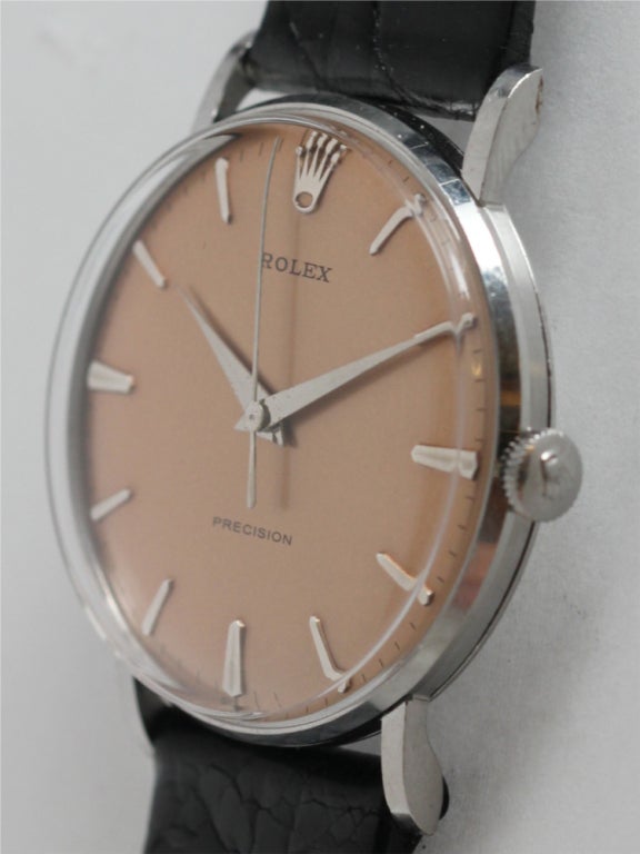 Rolex stainless steel dress model wristwatch Ref 9829, circa 1960. 33 x 39mm case with extended tapered lugs, with beautifully restored antique salmon dial with applied silver indexes and tapered silver dauphine hands, 17 jewel manual-wind movement
