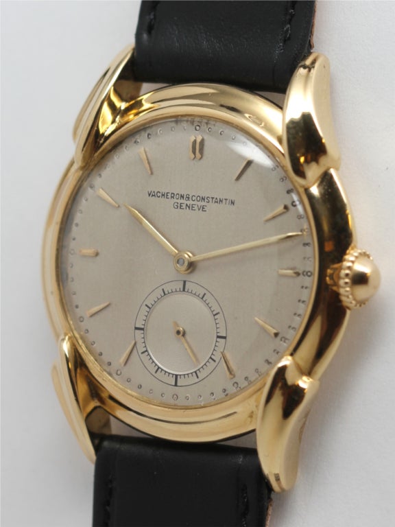 Vacheron & Constantin 18k yellow gold large dress wristwatch, 35 X 42.5mm case, with scrolled and fluted extended lugs, original mushroom-style crown, and pleasing silvered matte dial with gold applied baton and dagger indexes and gold baton hands.