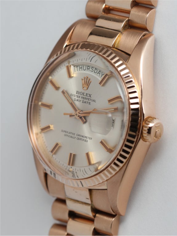 Rolex 18K PG Day Date President ref 1803 36mm diameter case with fluted bezel, original silver satin pie pan dial with pink gold applied indexes and pink baton hands. With 18K PG Rolex Presidential bracelet with open clasp. With original Rolex