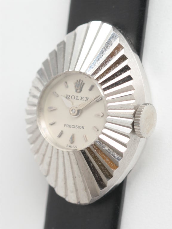 Lady's Rolex 18k white gold Chameleon wristwatch, circa 1960s. Marquise-shaped case with deep sunburst fluted design. Mint condition, showing very little use, mint original silvered dial. 17 jewel manual wind movement. Watch is designed to slide on