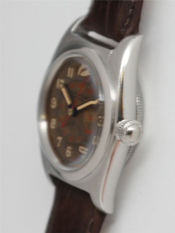 Rolex stainless steel Bubbleback, Ref. 2940, circa 1946, 32mm diameter tonneau shaped case with rare and original deeply patinaed luminous dial with inner 24 hour indexes printed in red. Contrasting lighter color patinaed Arabic numerals and