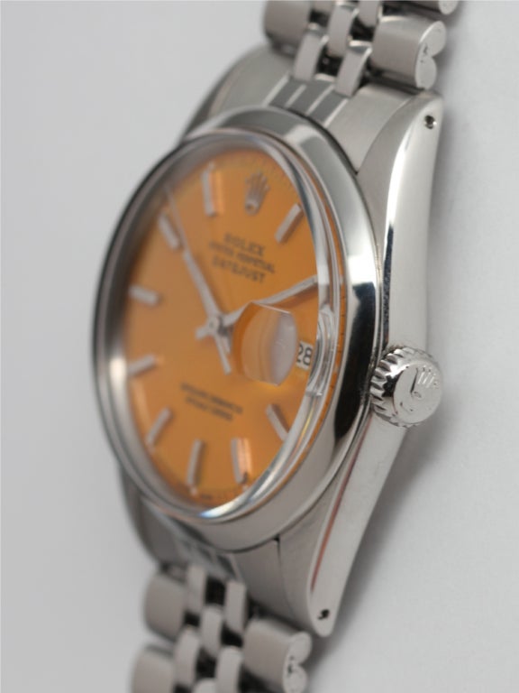 Rolex stainless steel Datejust, Ref 1603, serial 3.2 million, circa 1972. 36mm diameter full size man's model with smooth bezel. With beautiful custom-colored mandarin orange pie pan dial with applied baton indexes and baton hands. Cal. 1570