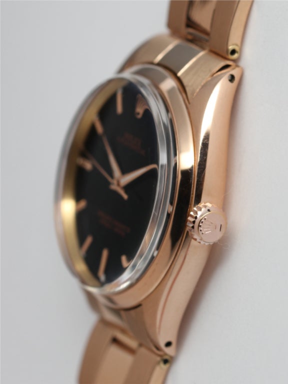 Rolex 18k pink gold Oyster Perpetual wristwatch, Ref 1005, serial 736,ZXXX, circa 1961, 34mm diameter case with smooth bezel and very beautiful glossy black dial with pink gold applied indexes and pink dauphine hands. Self-winding calibre 1560
