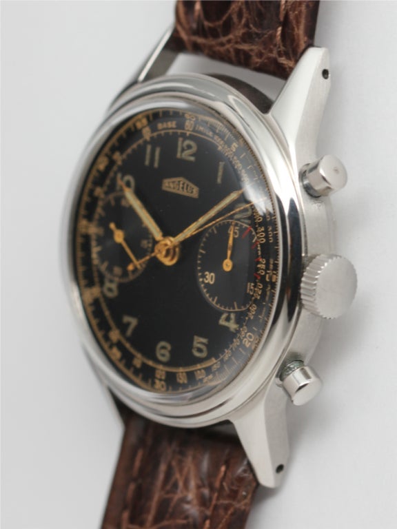 Angelus stainless steel two registers manual wind chronograph with original glossy black dial with gilt printing and luminous indexes and hands. Large 36mm diameter screw back case with round pushers. Great looking military-style chronograph.
Stk#