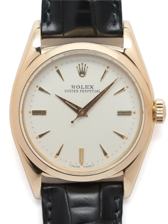 Rolex 18k yellow gold Oyster Perpetual wristwatch, Ref 6598, serial 322XXX, circa 1957. Full-size 36mm diameter case with smooth bezel and beautifully restored antique white dial with gold applied indexes and gold tapered dauphine hands.
