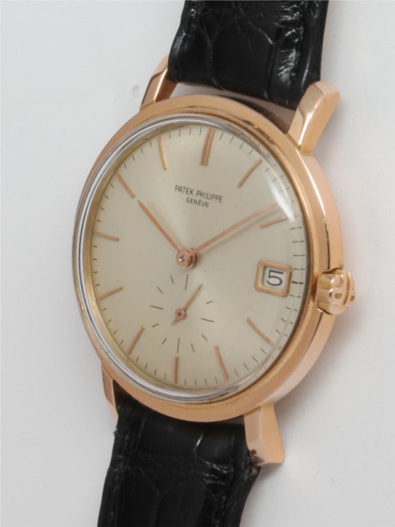 Patek Philippe 18k pink gold automatic wristwatch, Ref. 3445. Mint condition original silvered satin dial with pink gold applied indexes and pink hands. Screw down case back, 37-jewel automatic movement calibre 27/460M with date. A popular model in
