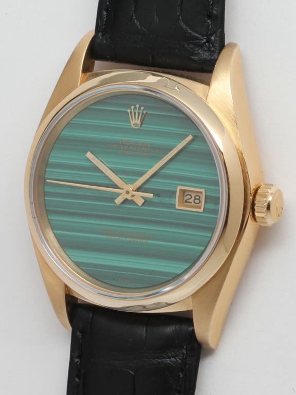 Rolex 18k yellow gold Datejust wristwatch with rare and original malachite dial, Ref # 16018. 36mm diameter case full size man's model with smooth bezel and sapphire crystal. Rolex calibre 3135 movement with sweep seconds and quick set date. Shown