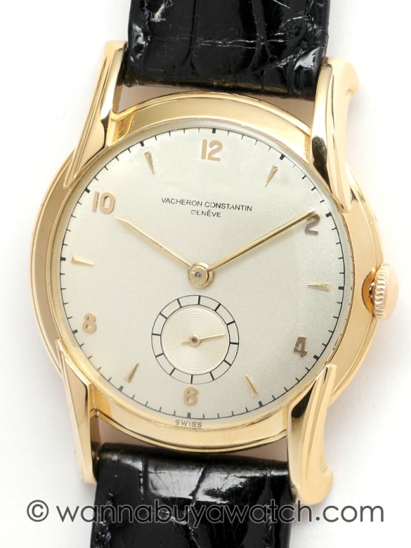 Vacheron & Constantin 18k yellow gold wristwatch, circa 1950s. Beautiful 35 X 40mm case with distinct long and fluted lugs, extending from edge of bezel. Original silvered satin dial with gold applied indexes and gold baton hands. Calibre V458