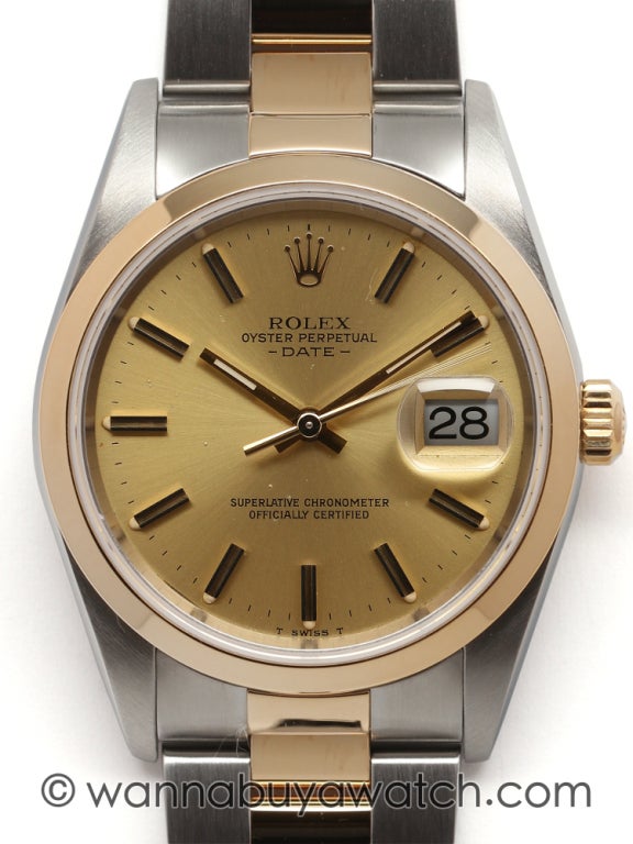 Rolex stainless steel and 18k yellow gold Oyster Perpetual Date wristwatch, Ref. 15223, D serial, circa 2005. 34mm diameter case with smooth bezel, sapphire crystal, champagne dial with applied gold indexes and hands. With Rolex stainless steel and