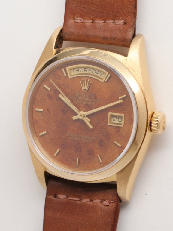 Rolex 18k yellow gold Day-Date President wristwatch, Ref. 18038, 36mm diameter case with sapphire crystal and smooth bezel, and factory wood burl dial. Calibre 3055 self-winding movement with quick set date, day of the week and sweep seconds.