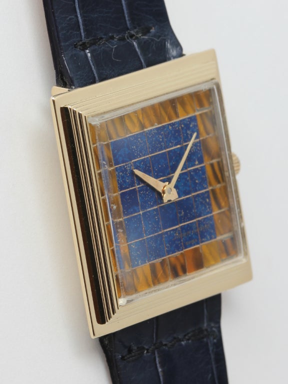 Lucien Piccard 14k yellow gold square case wristwatch, 30 X 30mm, with stepped bezel and very unusual checkerboard style mosaic dial composed of square tiles of lapis lazuli and tiger's eye. 17-jewel manual-wind movement. Unique and striking moderne