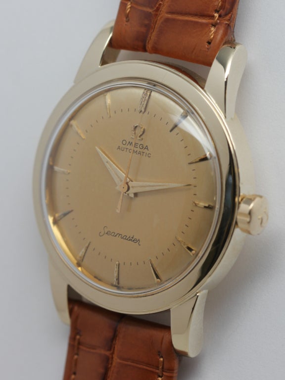 Omega yellow gold fIlled Seamaster wristwatch, circa 1950s, Ref. 12784. Wide bezel case with wide extended lugs, screw down caseback, signed Omega crown and very pleasing original matte champagne dial turn a warm golden glow. Gold applied indexes,