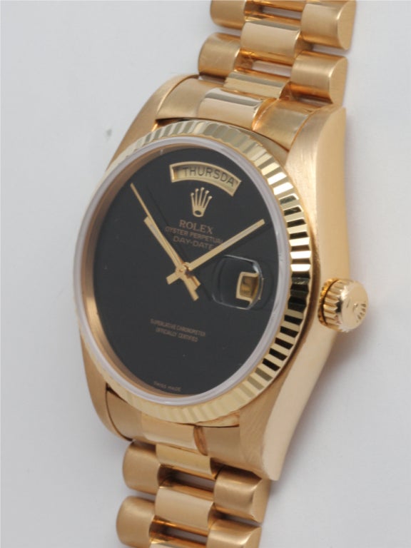 Rolex 18k yellow gold Day-Date President wristwatch, Ref. 18038, serial 6.5 million, circa 1981, with Rolex factory Onyx dial. 36mm diameter case with fluted bezel, sapphire crystal, quick-set date, calibre 3055 movement. With associated 18k yellow