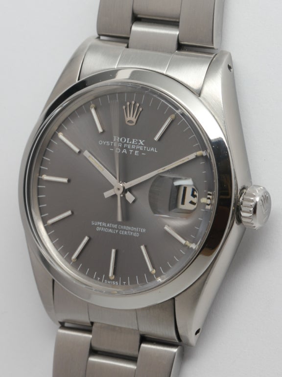 Rolex stainless steel Oyster Perpetual Date wristwatch. Ref. 1500, serial 2.2 million, circa 1969. 34mm diameter case with smooth bezel, screw down Oyster crown, charcoal grey original dial with applied indexes and baton hands. On Rolex stainless