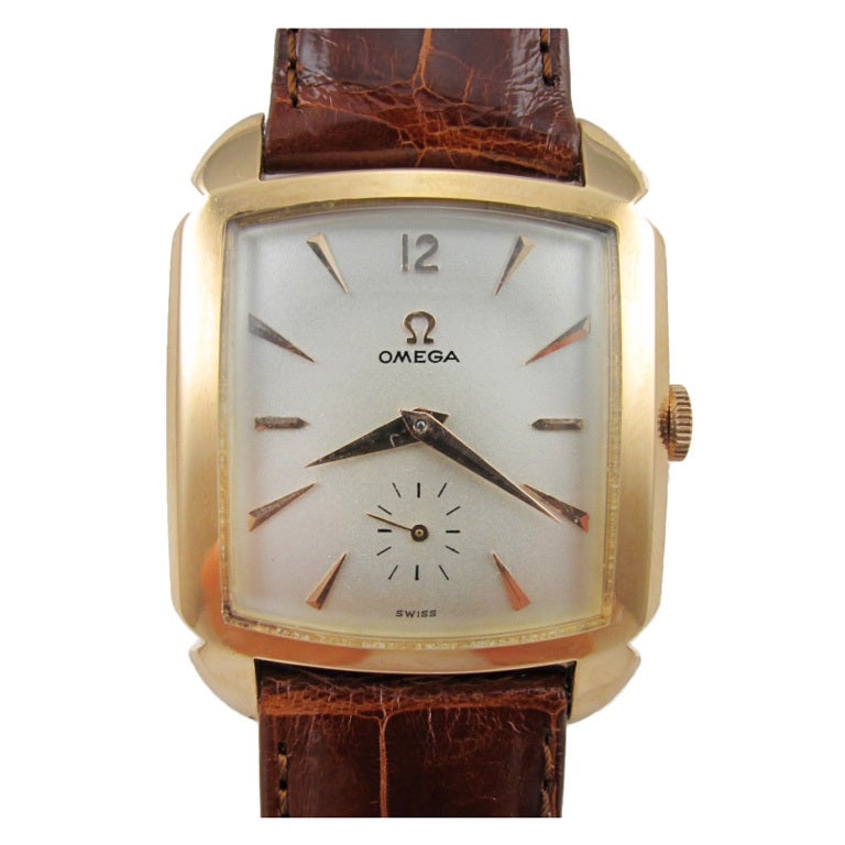 Omega 18k rose gold automatic wristwatch, circa 1950's.  Large square 31 x 40mm, case with wide bezel with lobed lugs. With nicely restored silvered satin dial with applied pink gold indexes and tapered dauphine hands. Great looking large and