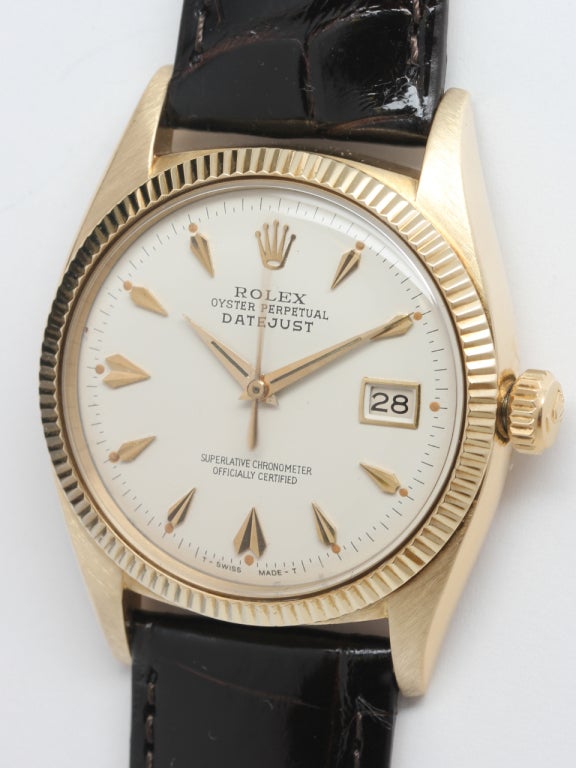 Rolex 14k yellow gold Oyster Perpetual Datejust wristwatch, Ref. 6605, serial 309,XXX, circa 1957. 36mm diameter case with beautifully restored antique white dial with eccentric indexes, fine textured fluted bezel. Calibre 1065 self-winding