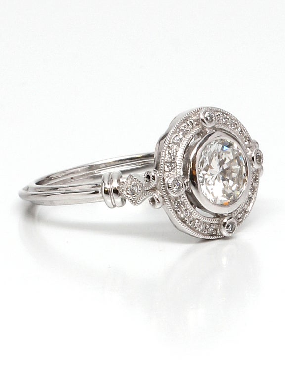 1.01ct round brilliant cut diamond G color VS2 clarity, surrounded by micro pave diamonds 0.13ctw. Set in beautiful 18K White Gold with lovely detailed gallery & stylized band. Contemporary ring with beautiful vintage styling. EGL US cert. Stunning,