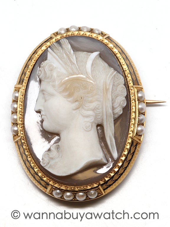 Spectacular, Victorian hard stone cameo with a background of banded agate. Deeply carved, beautiful woman's profile with curled upswept hair adorned with stalks of wheat. Possibly Greek Goddess Ceres. Framed in 15K yellow gold with 3 distinct and