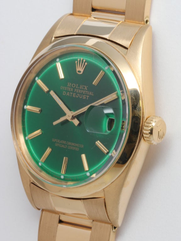 Rolex 18k yellow gold Datejust wristwatch  Ref# 1601, serial number 1.19 million, circa 1964. Featuring 36mm diamete rcase with smooth bezel, acrylic crystal and custom colored intense emerald green pie pan dial, with gold applied indexes and gold