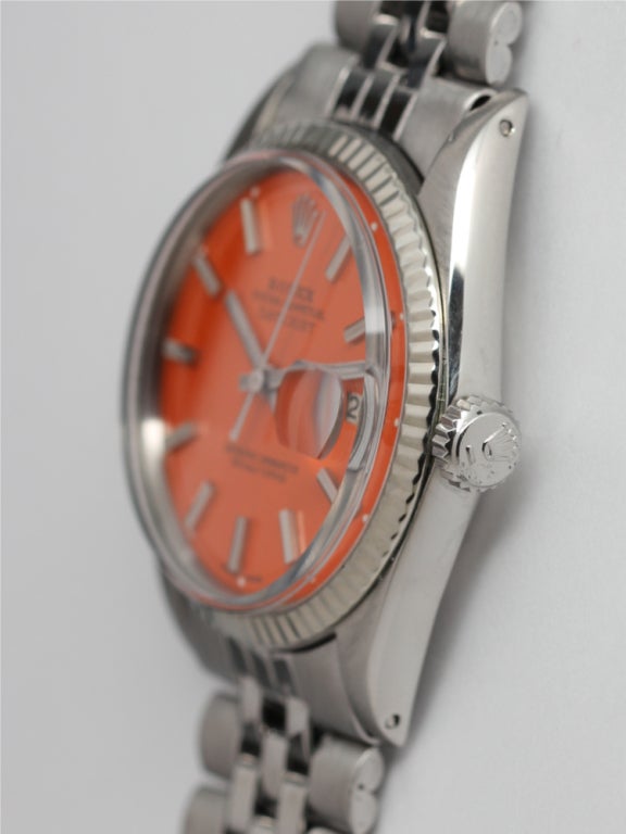 Rolex stainless steel Datejust wristwatch, Ref. 1603, serial number 1.8 million, circa 1968. 36mm case with 14k white gold fluted bezel. With beautiful custom-colored valencia orange pie pan dial with applied indexes and baton hands. Calibre 1570