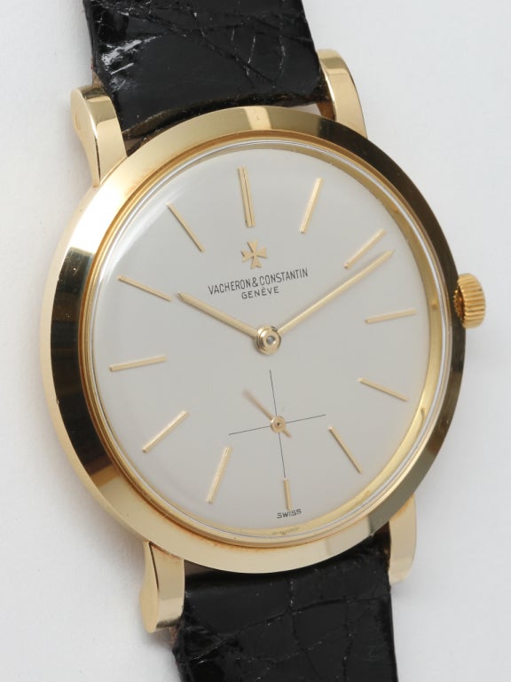 Vacheron & Constantin 18k yellow gold dress model wristwatch, 35 x 41mm screw back case with wide sloped bezel and heavy lobed lugs, circa 1958. Gorgeous and elegant model with pristine original matte silvered dial with gold indexes and gold applied