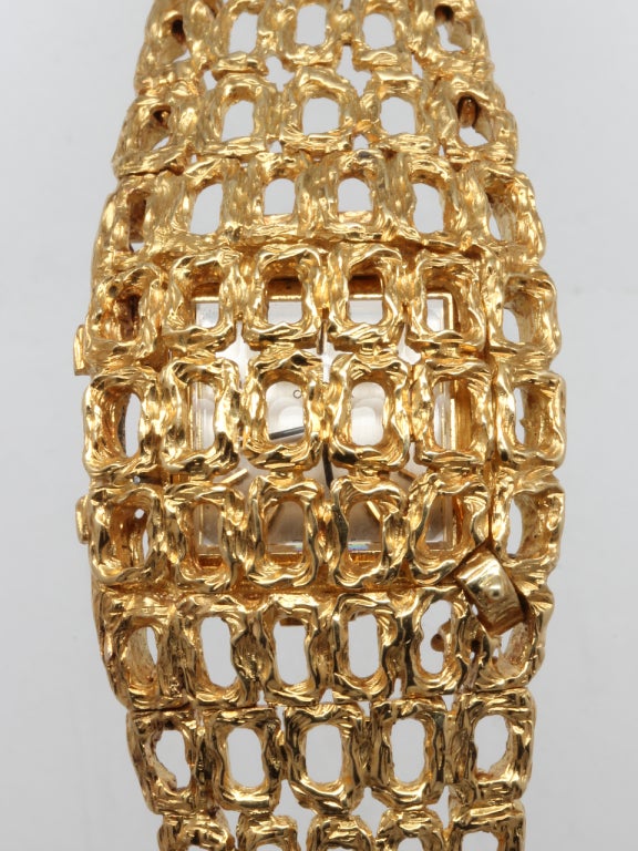Omega 18k yellow gold quadruple signed (dial, movement, case back, bracelet clasp) fancy concealed-dial bracelet watch with textured finish, circa 1970s.

With mint condition original silvered satin dial with applied gold indexes and applied Omega