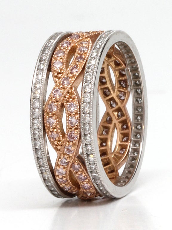 Two platinum diamond bands with a 18K rose gold and cognac diamonds braided center (infinity symbol) band. This is a modern piece that is vintage inspired. Approximately 1.35ct total diamond weight. 8mm wide in size 6 (photo'd). All sizes available