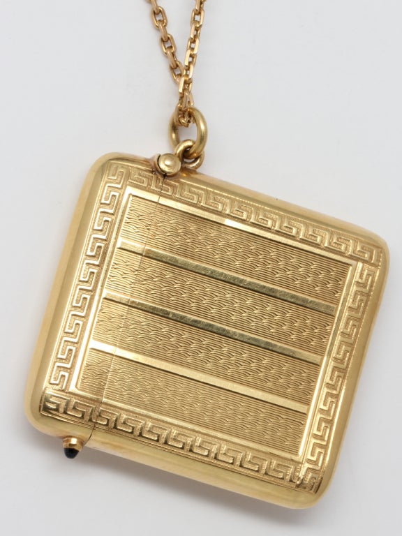 18K yellow gold Art Deco match safe, in pristine condition, shown on antique chain to be worn as a gorgeous and distinctive necklace or locket. Measuring 1.75 x 2 inches. Bowed shape designed to comfortably fit a pocket. Decorated with finely