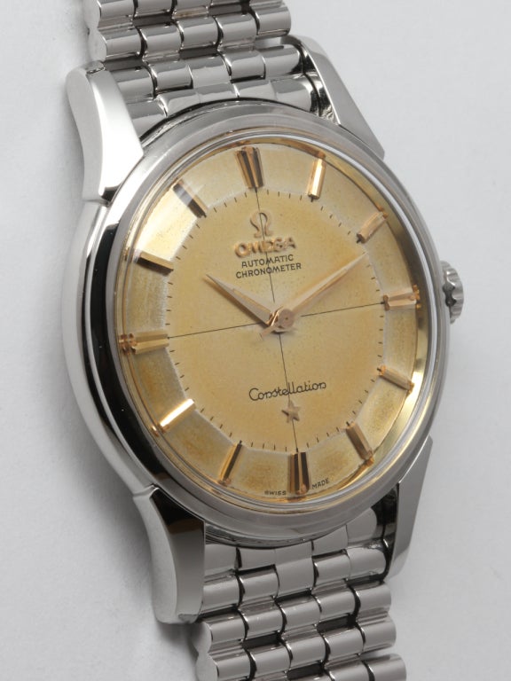 Omega stainless steel Constellation wristwatch, Ref# 14381-5SC, circa 1960s. Featuring 35mm diameter case with screw down back and gold Observatory logo. With very pleasing patina'd two tone pie pan dial with applied indexes, applied Omega symbol