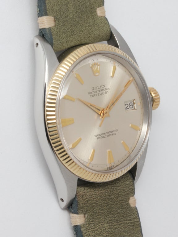 Rolex stainless steel and 14k yellow gold Datejust wristwatch, Ref. 1601, serial number 582,XXX, circa 1961. 36mm diameter case with fine 14k yellow gold milled bezel, acrylic crystal and pleasing original silvered dial with applied tapered indexes
