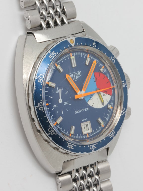 Heuer Stainless Steel Skipper circa 1974. Great condition bright color dial, hands, and blue unidirectional elapsed time bezel, with large 3 color 3 o'clock count down register. Signed Heuer crown and original signed Heuer rice link braclet. Calibre