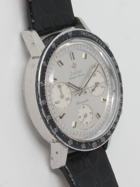 Zodiac stainless steel Zodia-Chron Hermetic three-register, manual-wind chronograph wristwatch. 36 x 43mm screw back case with black fixed tachometer bezel, round pushers, circa 1960s. Original silvered satin dial with applied indexes and applied
