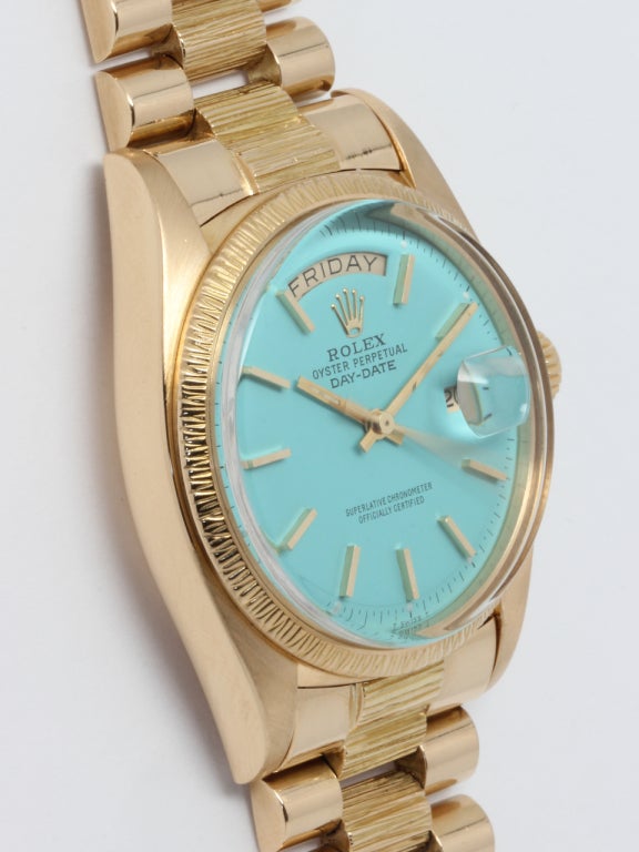 Rolex 18k yellow gold Day-Date wristwatch, Ref. 1807, serial number 5.0 million, circa 1977. 36mm diameter full-size man's model with bark finish bezel, re-printed dial. With original bark finish 18k yellow gold President bracelet with deployant