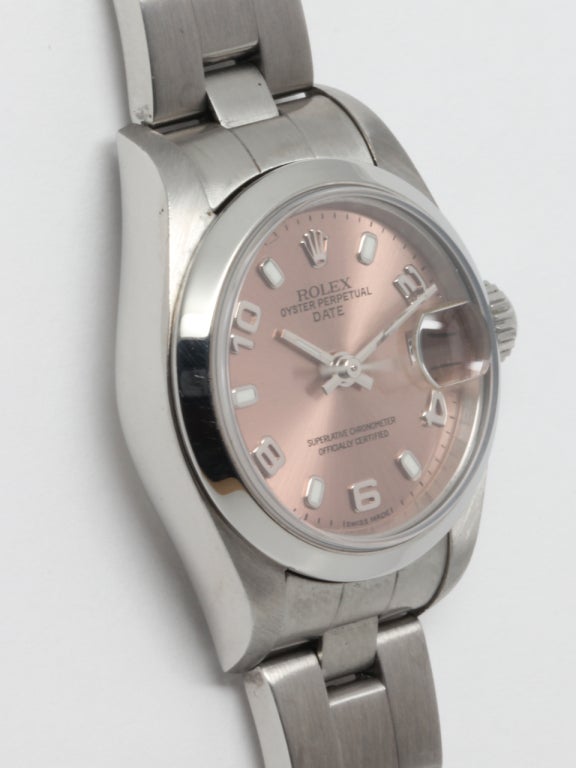 Rolex lady's stainless steel Oyster Perpetual Date wristwatch, Ref. 79240, serial number D2, circa 2005. 27mm case with smooth bezel and sapphire crystal, with beautiful salmon dial with arabic figures and luminous bars. Self-winding movement with