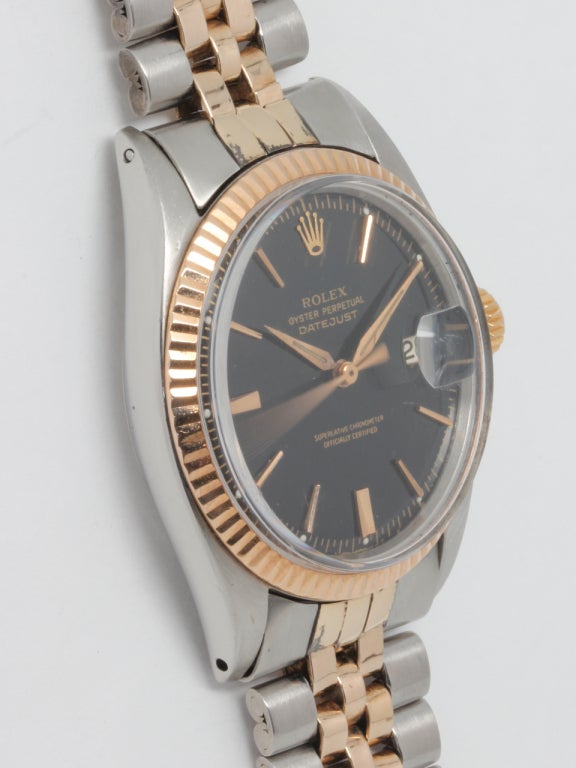 Rolex stainless steel and 14k rose gold Datejust wristwatch, Ref. 1601, serial number 1.0 million, circa 1970. 36mm diameter case with 14k rose gold fluted bezel, acrylic crystal, beautifully restored glossy black dial with pink gold applied indexes