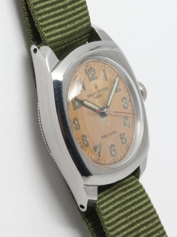 Rolex stainless steel Oyster Army wristwatch, Ref. 4301, circa 1940s. Cushion Oyster case with screw back and screw down crown, original dial with patina. Currently shown on a green Nato strap. 

Like all our watches, this classic model has been
