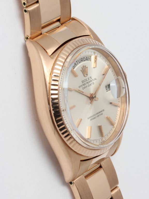 Rolex 18k rose gold Day-Date President wristwatch, Ref. 1803, case back engraved 1966. 36mm diameter case with smooth bezel and acrylic crystal, very pleasing original silvered satin dial with applied pink indexes and pink baton hands. Self-winding