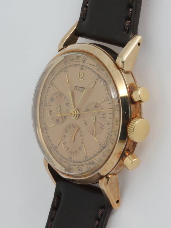Tissot 14k yellow gold three-register manual-wind chronograph wristwatch, circa 1950s. 36 X 45mm case with large extended grasshopper lugs. Beautiful original two-tone champagne dial with gold applied indexes and hands. Calibre 27-41H three-register