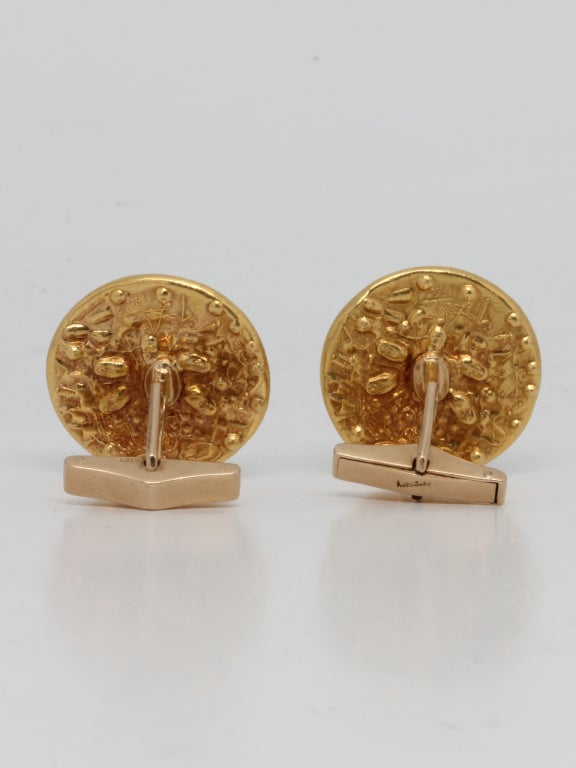 Striking pair of 22K yellow gold coin cufflinks depicting profiles of
Salvador Dali & his wife, Gala. Inspired by Louis XIV , 