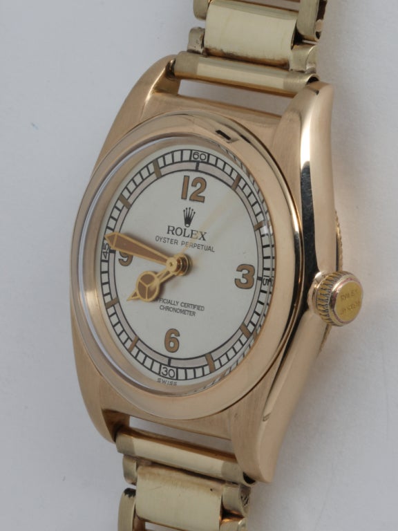 Rolex 14k yellow gold Bubbleback wristwatch with associated period 14k yellow gold bracelet. Great looking model, 32mm tonneau Oyster case with screw back and crown. Beautifully restored two-tone dial with Mercedes hands. Self-winding N/A movement