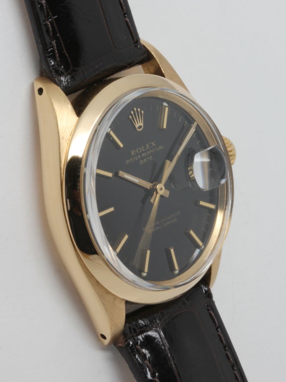 Rolex 18k yellow gold Oyster Perpetual Date wristwatch, Ref. 1503, serial number 2.8 million, circa 1971. 34mm case with smooth bezel, acrylic crystal, beautiful glossy black dial with applied indexes and baton hands. Powered by a calibre 1570